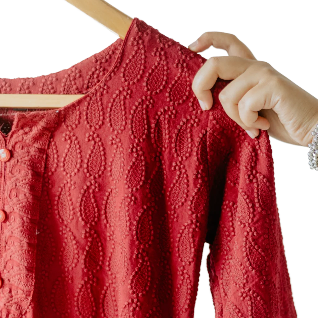 an indian red kurti on hanger