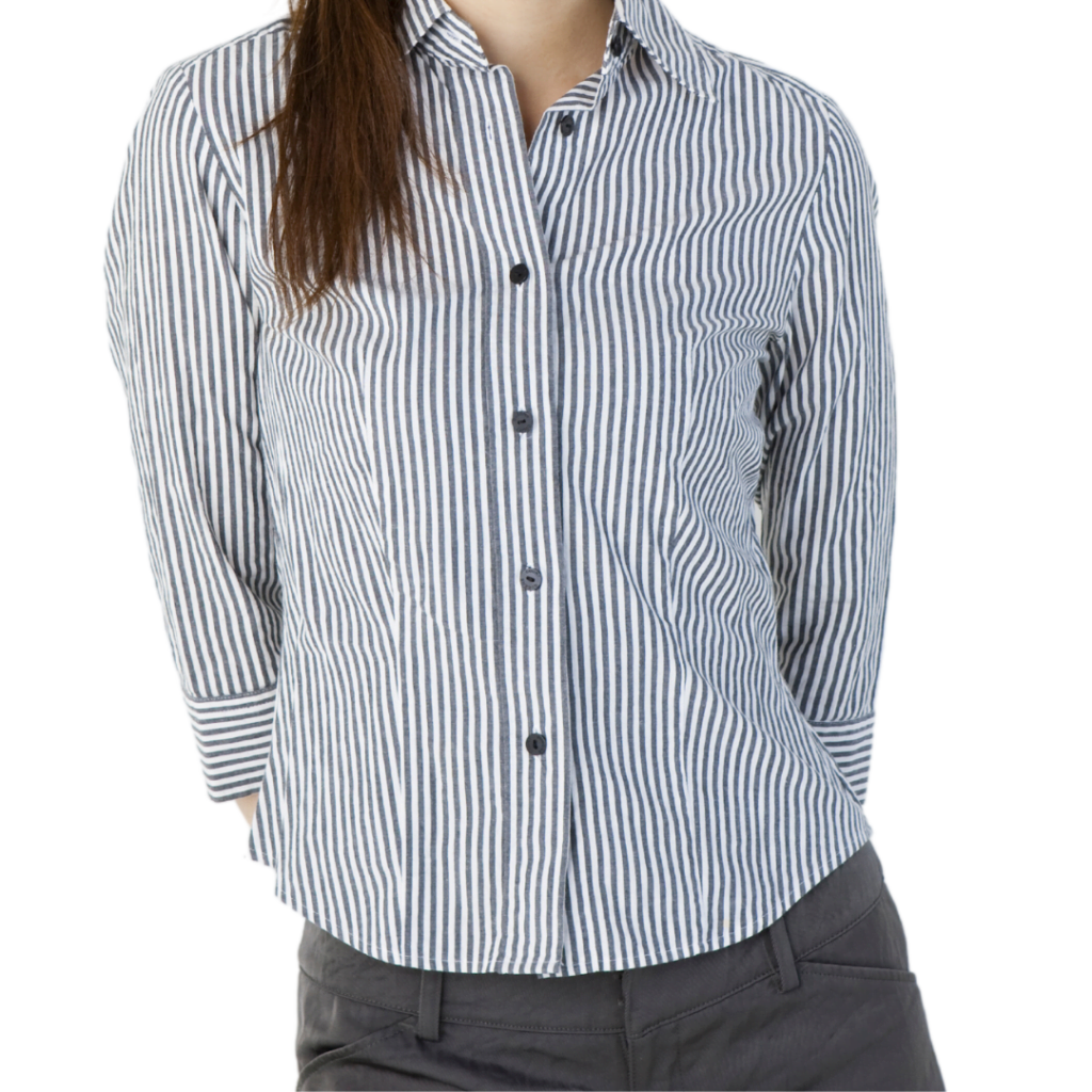 a woman wearing grey and white striped shirt