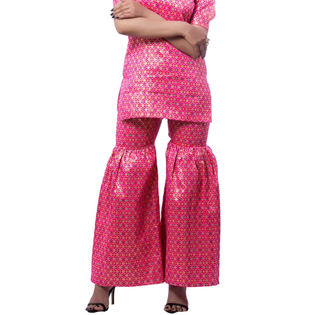 a woman wearing pink top and pink indian garara