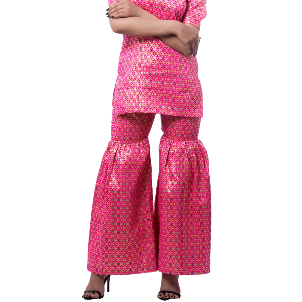 a woman wearing pink top and pink indian garara