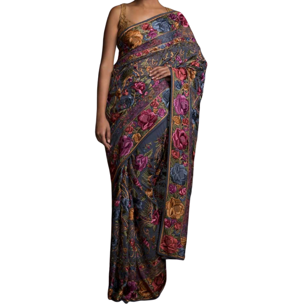 a woman wearing grey, pink and golden indian saree