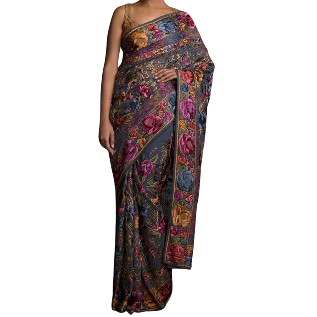 a woman wearing grey, pink and golden indian saree