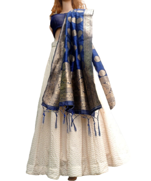 a manequin wearing white Indian lehenga with blue dupatta and blouse